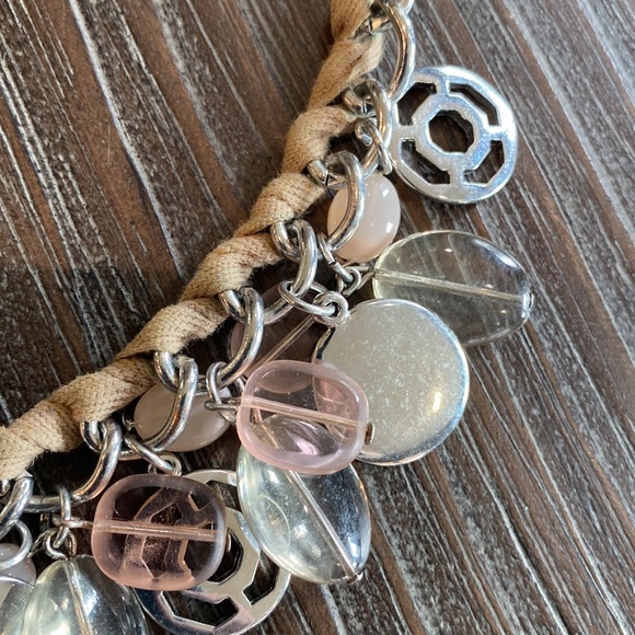 Nygard necklace intertwined with ribbon and silver and pink bangles. - Picture 6 of 6